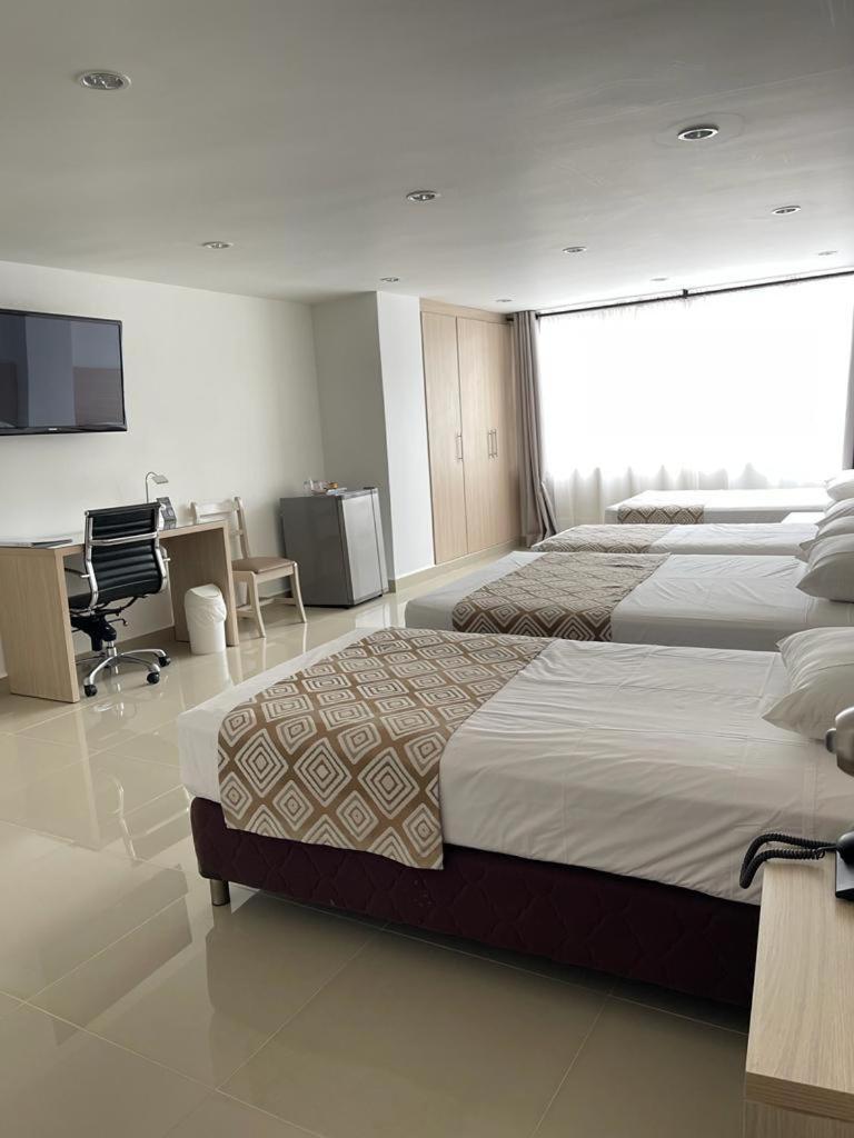 Hotel Juan Maria Tulua Bagian luar foto