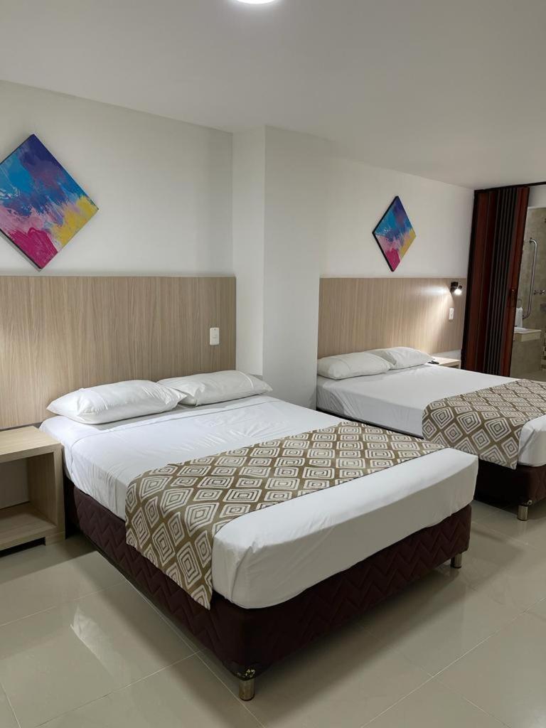 Hotel Juan Maria Tulua Bagian luar foto